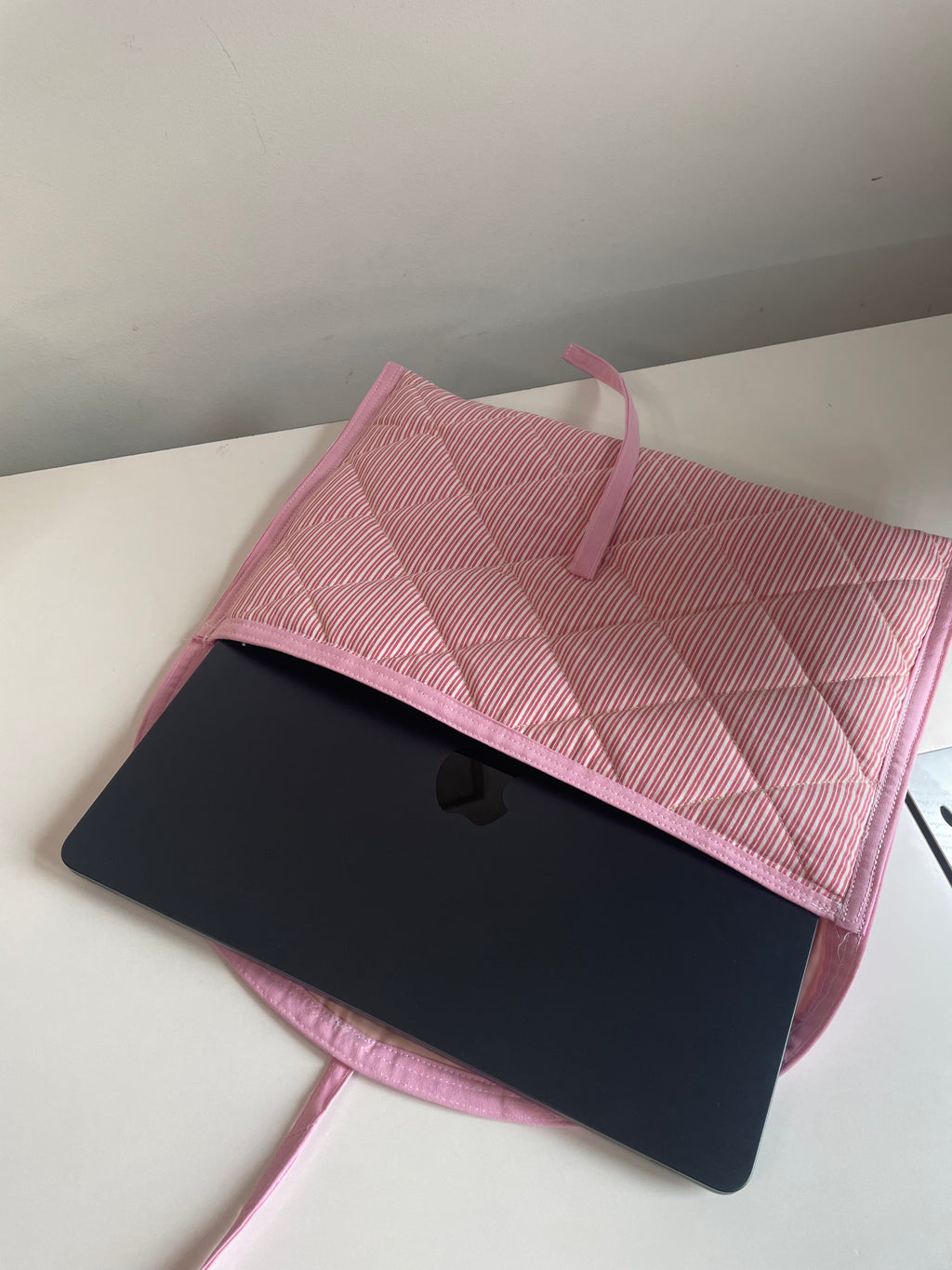 La housse d'ordinateur rose